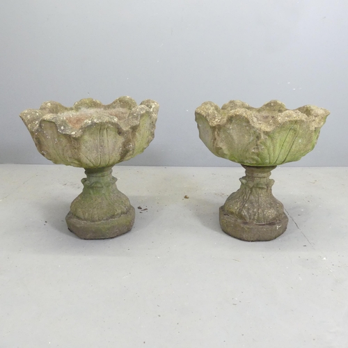 108 - A pair of two section weathered concrete garden urns. 47x44cm.