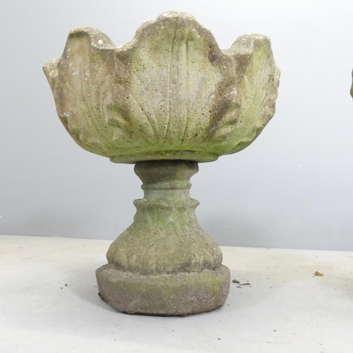 108 - A pair of two section weathered concrete garden urns. 47x44cm.