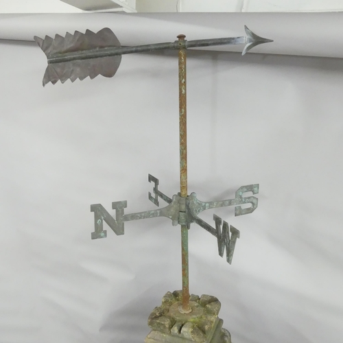 120 - A Victorian copper weathervane mounted on weathered natural stone base and plinth. 60x166x60cm.