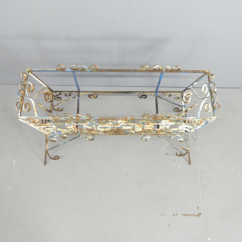 121 - A vintage painted wrought iron plant stand. 97x66x34cm.