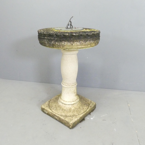 134 - A weathered stone two-section garden sun dial. 43x76cm.