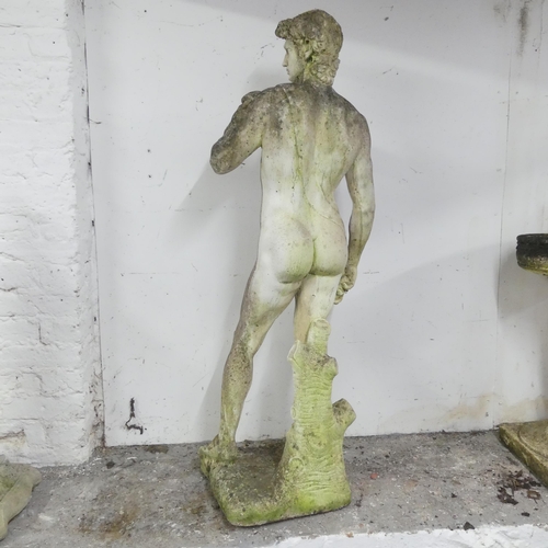 35 - A weathered stone garden sculpture, after Michelangelo's David. Height 120cm.