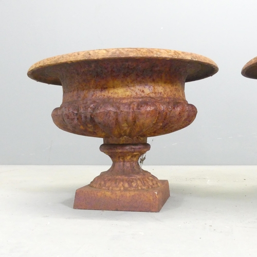 135 - A pair of small cast iron Campana style urns. 33x24cm.