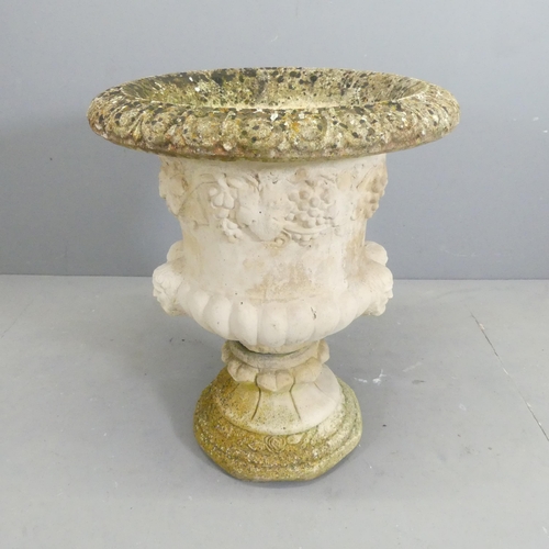 136 - A two-section weathered and painted concrete garden urn, with classical Grecian design. 55x66cm.