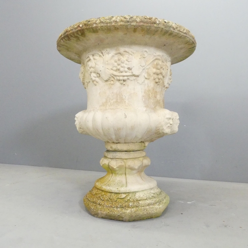 136 - A two-section weathered and painted concrete garden urn, with classical Grecian design. 55x66cm.