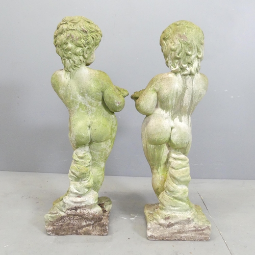 11 - A pair of weathered stone Putti / cherubs of male and female form. Height 73cm.