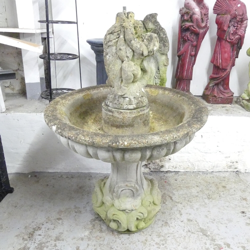 141 - A weathered concrete three section garden fountain. 84x122cm