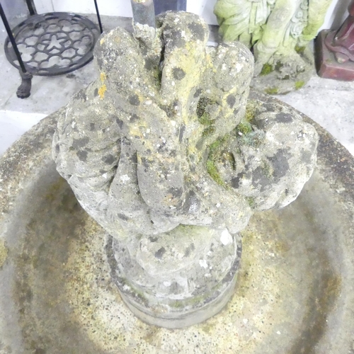 141 - A weathered concrete three section garden fountain. 84x122cm