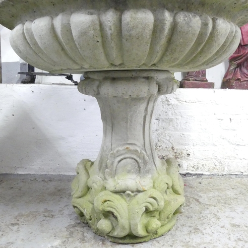 141 - A weathered concrete three section garden fountain. 84x122cm