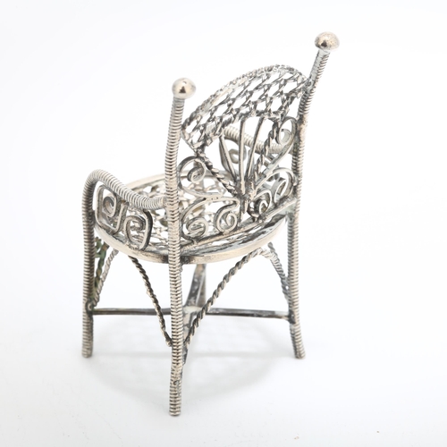 230 - A Continental miniature silver doll's armchair, apparently unmarked, 6cm