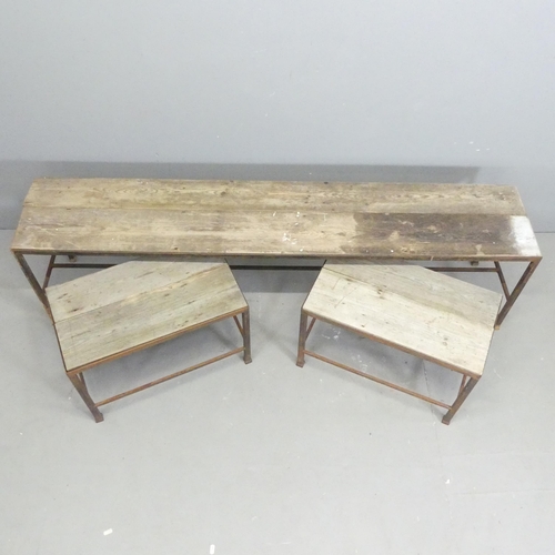 142 - Three various low garden tables, with pine tops on cast metal bases. Largest 164x45x32cm, smallest 5... 