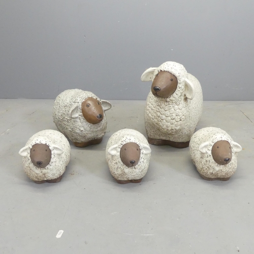 143 - A flock of five glazed ceramic sheep ornaments. Largest 46x36x25cm.