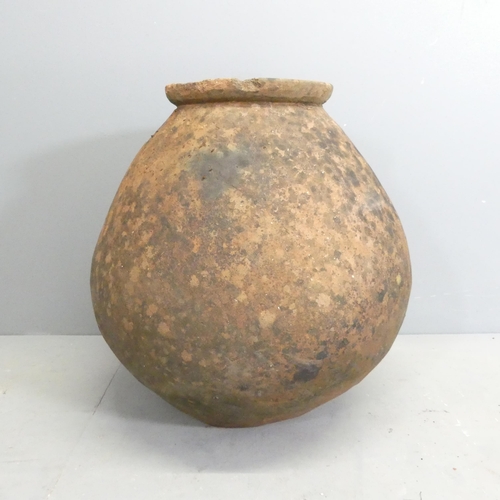 144 - An antique hand made terracotta water jar. 50x58cm.