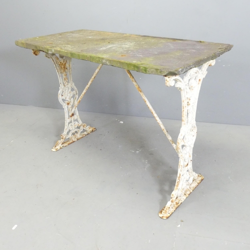 148 - An antique slate topped garden table on painted cast iron base. 101x72x48cm.