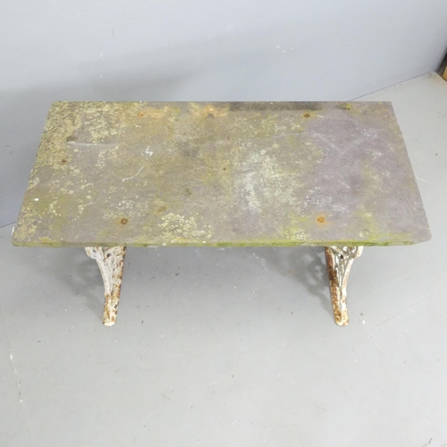 148 - An antique slate topped garden table on painted cast iron base. 101x72x48cm.