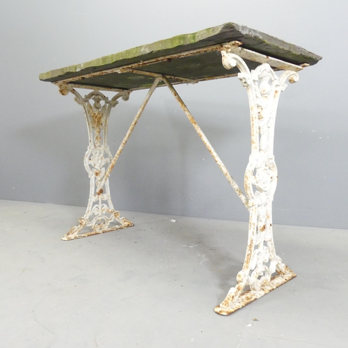 148 - An antique slate topped garden table on painted cast iron base. 101x72x48cm.