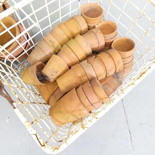 149 - A quantity of approximately 140 terracotta pots. Largest 15cm, smallest 5cm.