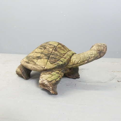 151 - A carved and weathered teak garden sculpture, study of a tortoise. Length 50cm.