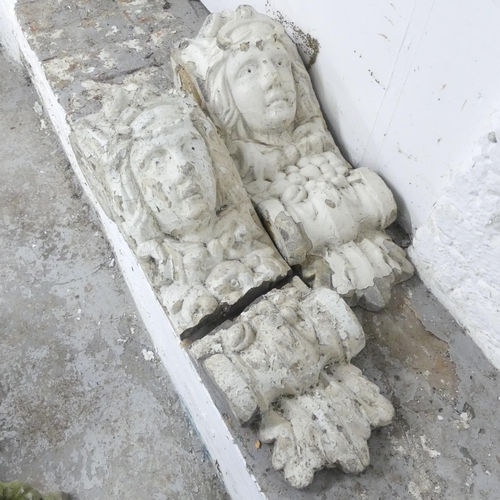 152 - A pair of antique painted stone corbels, one A/F. 21x66x22cm.