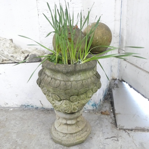 154 - A weathered concrete two-section garden urn. 48x63cm.