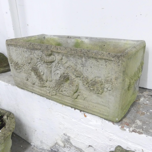 155 - A weathered stone garden trough, with mythical beast and foliate decoration. 80x34x40cm.