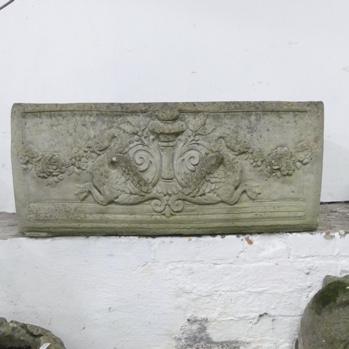 155 - A weathered stone garden trough, with mythical beast and foliate decoration. 80x34x40cm.