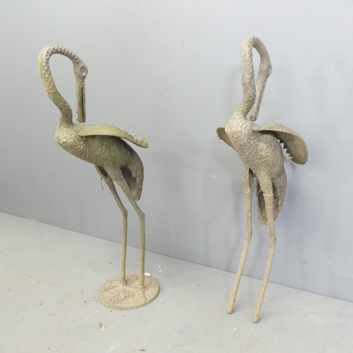 156 - A pair of weathered cast metal Heron garden ornaments, one lacking base. Height 73cm.