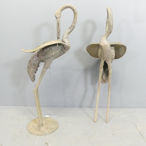 156 - A pair of weathered cast metal Heron garden ornaments, one lacking base. Height 73cm.