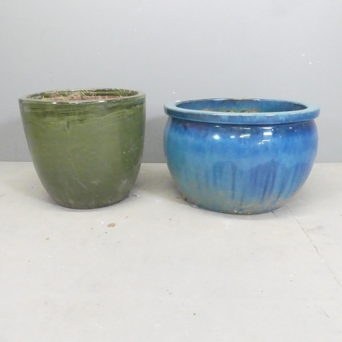 158 - Two modern glazed terracotta garden pots. Largest 52x33cm.