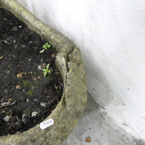 159 - An antique weathered stone planter of shaped form. 82x38x43cm.