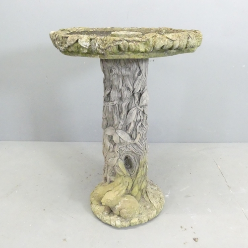 164 - A tree and hare design weathered concrete bird bath. 49x71cm.