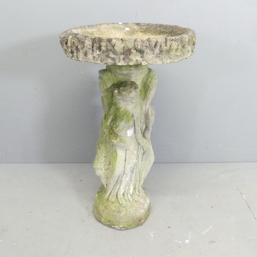 165 - A weathered concrete two-section bird bath, depicting the three Graces. 41x73cm.