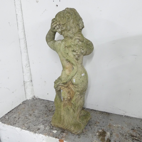 166 - A weathered concrete garden statue, study of a Putti / cherub. Height 90cm.