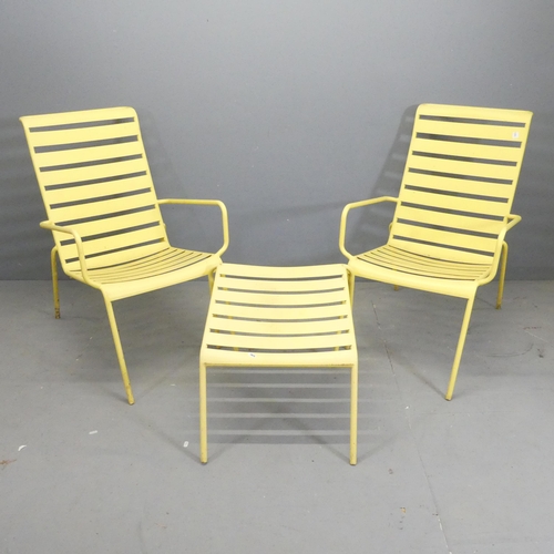 169 - A pair of modern painted metal garden loungers, with matching table / footstool.