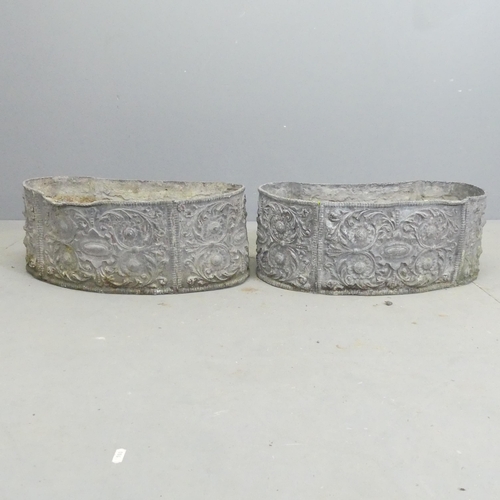 171 - A pair of 19th century lead kidney-shaped planters, with foliate decoration. 55x22x28cm.