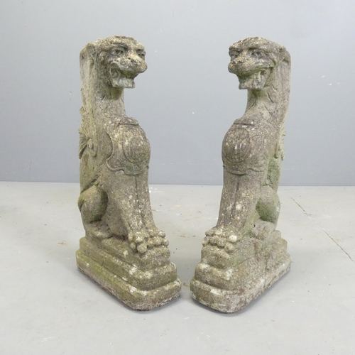 172 - A pair of weathered concrete dragon garden ornaments. 26x49x12cm.