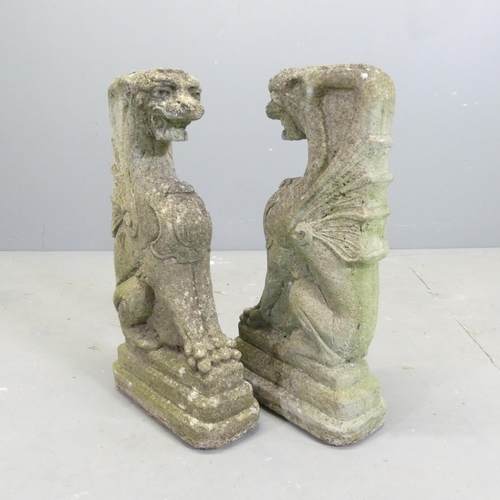 172 - A pair of weathered concrete dragon garden ornaments. 26x49x12cm.