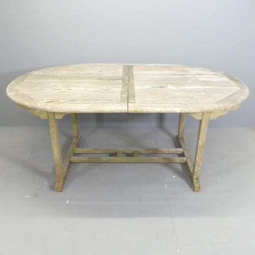 180 - BRAMBLECREST - A weathered teak draw-leaf extending garden table. 179x74x120cm (extending to 240cm).... 