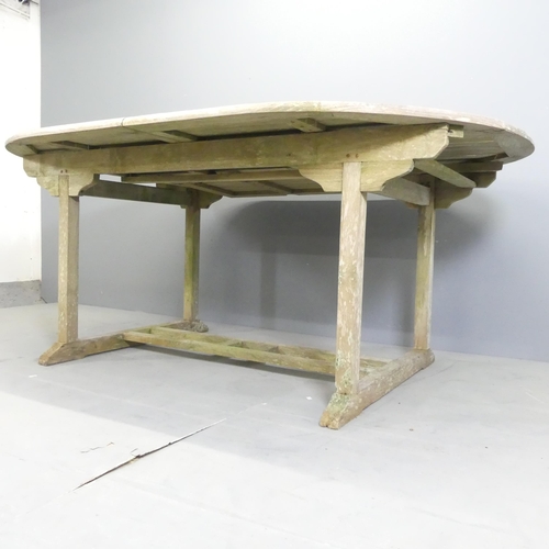 180 - BRAMBLECREST - A weathered teak draw-leaf extending garden table. 179x74x120cm (extending to 240cm).... 