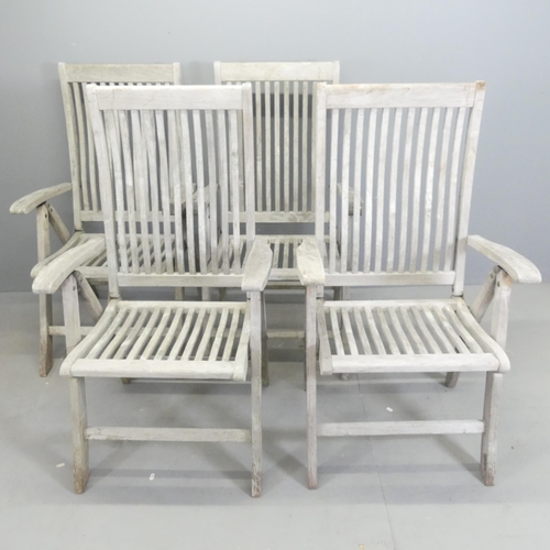 182 - BRAMBLECREST - A set of four weathered teak folding and reclining garden chairs. With maker's labels... 