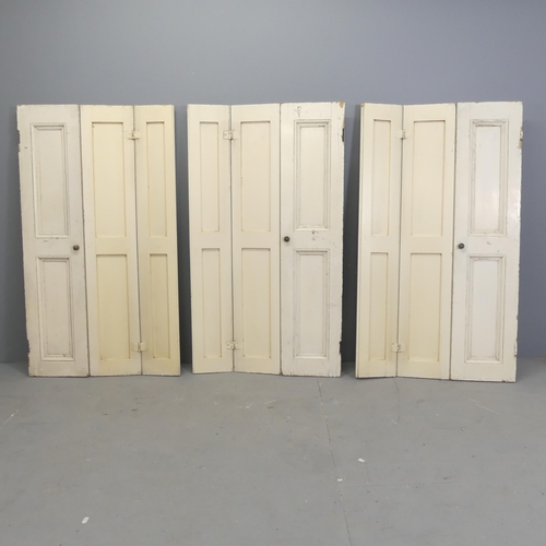 189 - Three antique panelled pine three-fold shutters. Each overall 70x123cm.