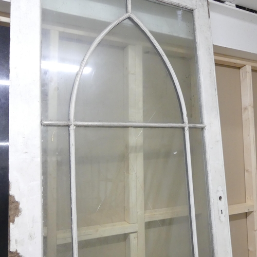 191 - A double glazed door with lattice decoration. 94.5x215cm.