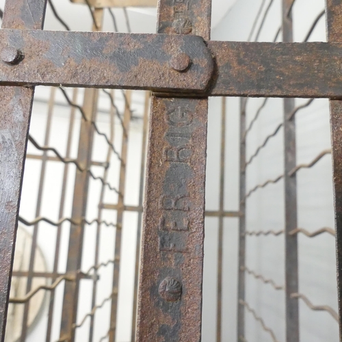 197 - An antique French iron wine cabinet, with two doors and marked 