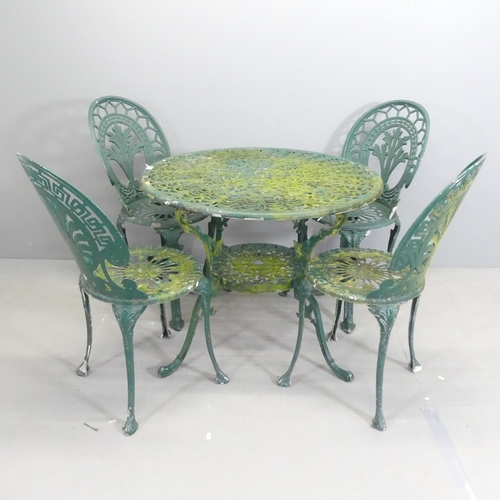 198 - A painted cast aluminium circular two-tier garden table, 86x67cm, with four matching chairs.