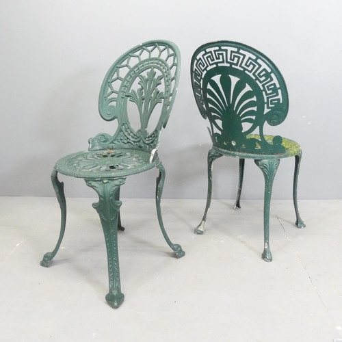 198 - A painted cast aluminium circular two-tier garden table, 86x67cm, with four matching chairs.