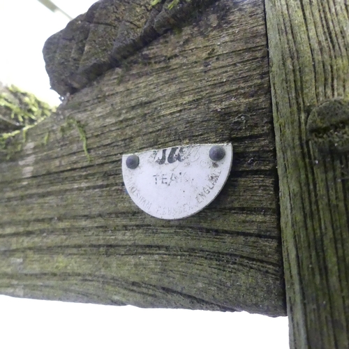 201 - LISTER - A weathered teak slatted garden bench, with maker's badge to side. 185x95x72cm.... 