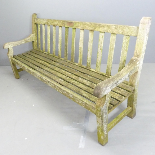 202 - A weathered teak slatted garden bench, in the manner of Lister. 201x98x65cm.