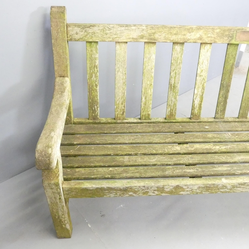 202 - A weathered teak slatted garden bench, in the manner of Lister. 201x98x65cm.