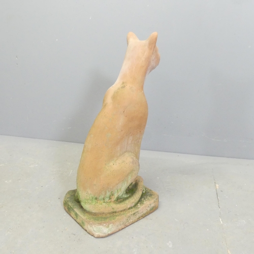 57 - A terracotta garden statue, study of a seated cat. Height 52cm.