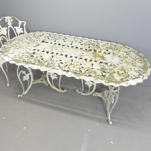 261 - A painted aluminium oval garden table, 180x70x89cm, with two matching two-seater benches and arm cha... 